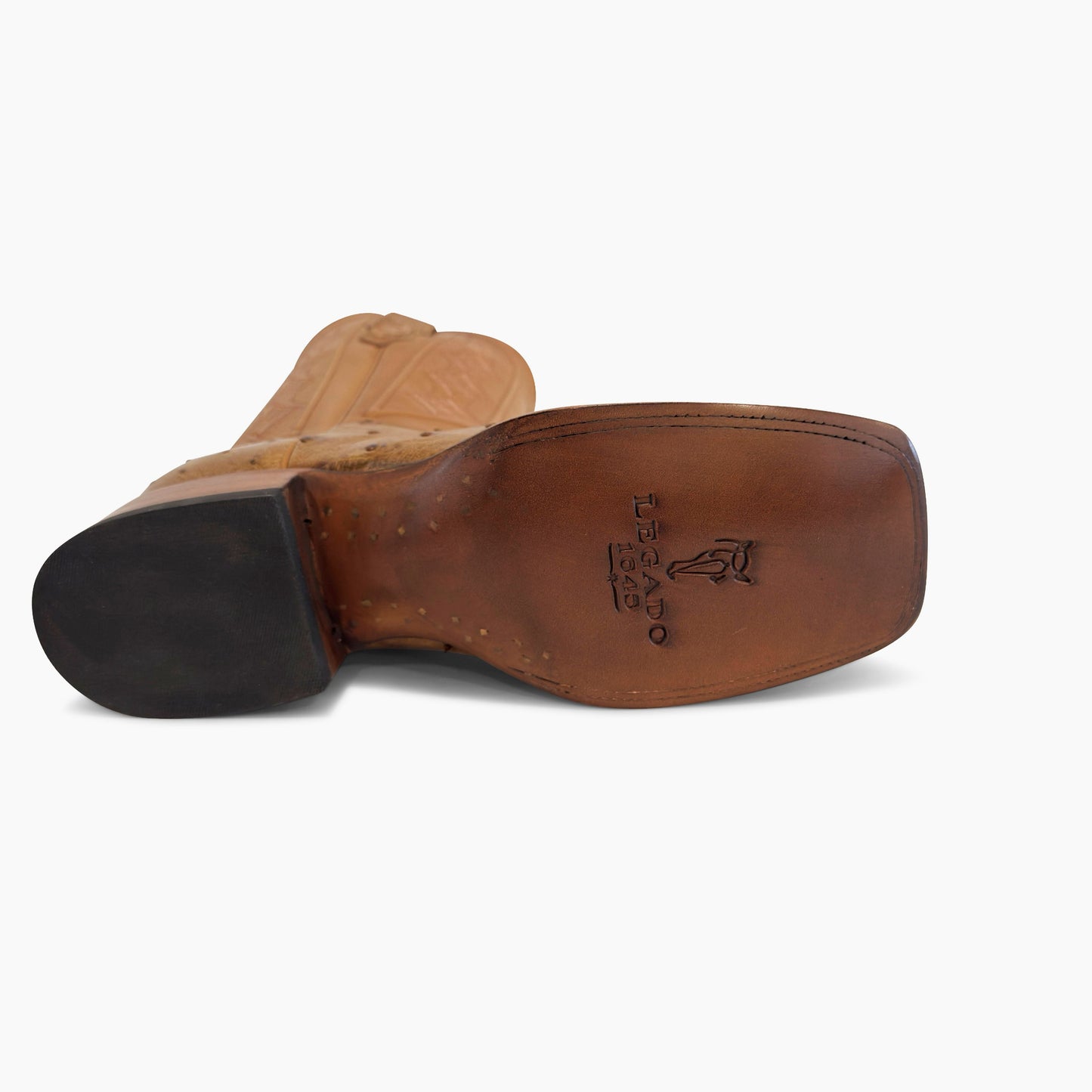 Don Pascual desert full quill ostrich square toe cowboy boot — leather sole detail showing Legado 1849 stamp and natural leather outsole