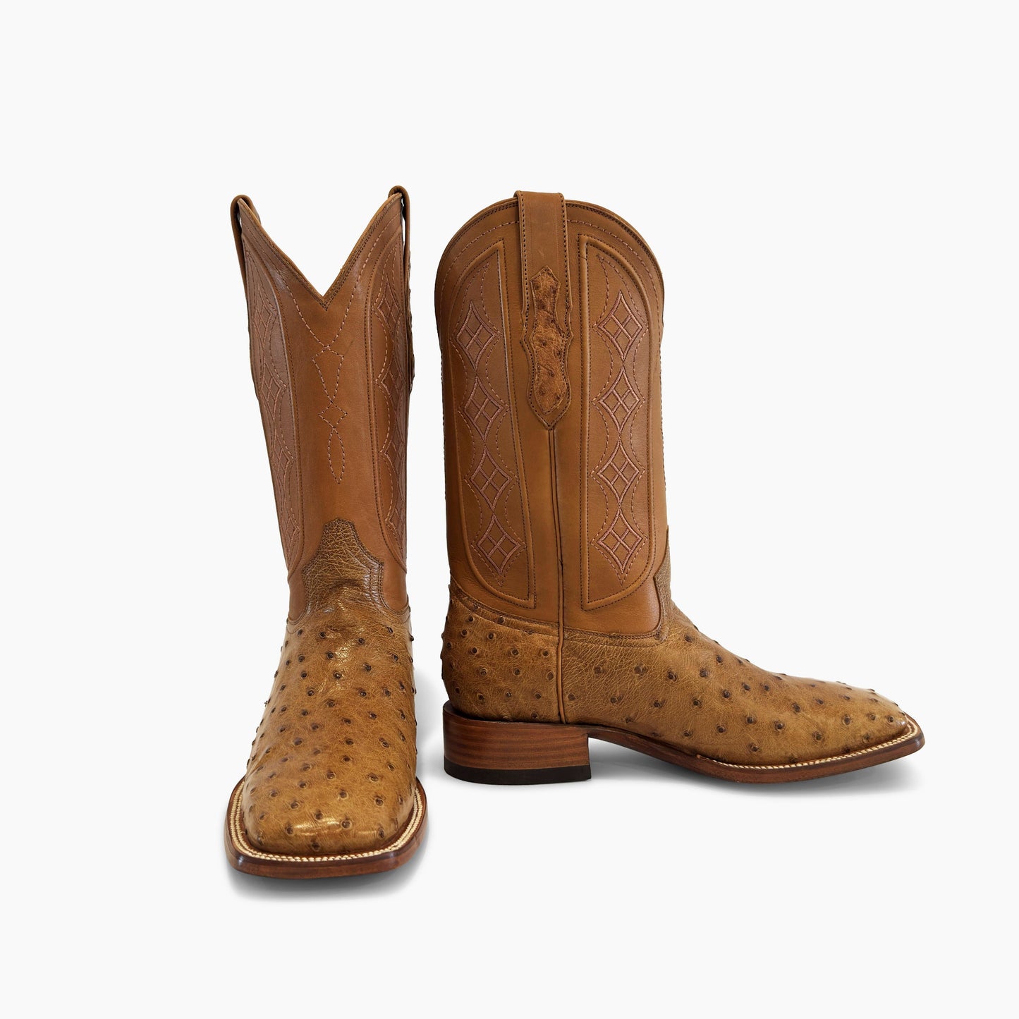 Don Pascual desert full quill ostrich square toe cowboy boot — pair showing front and side view with tan cowhide diamond stitch shaft and ostrich pull-tab detail