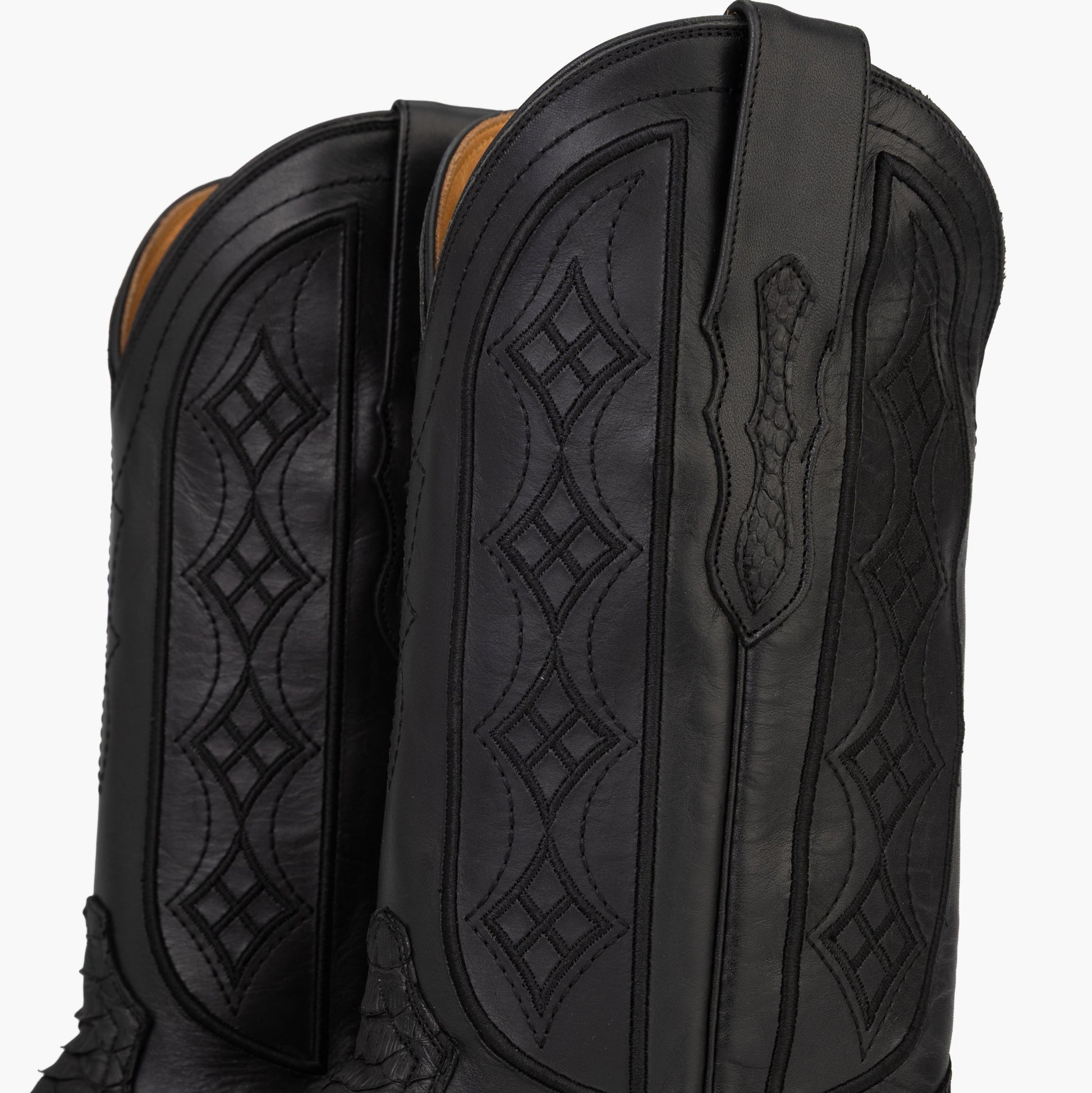 Don Pascual matte black python square toe cowboy boot — close-up of black cowhide shaft showing embossed diamond stitch pattern