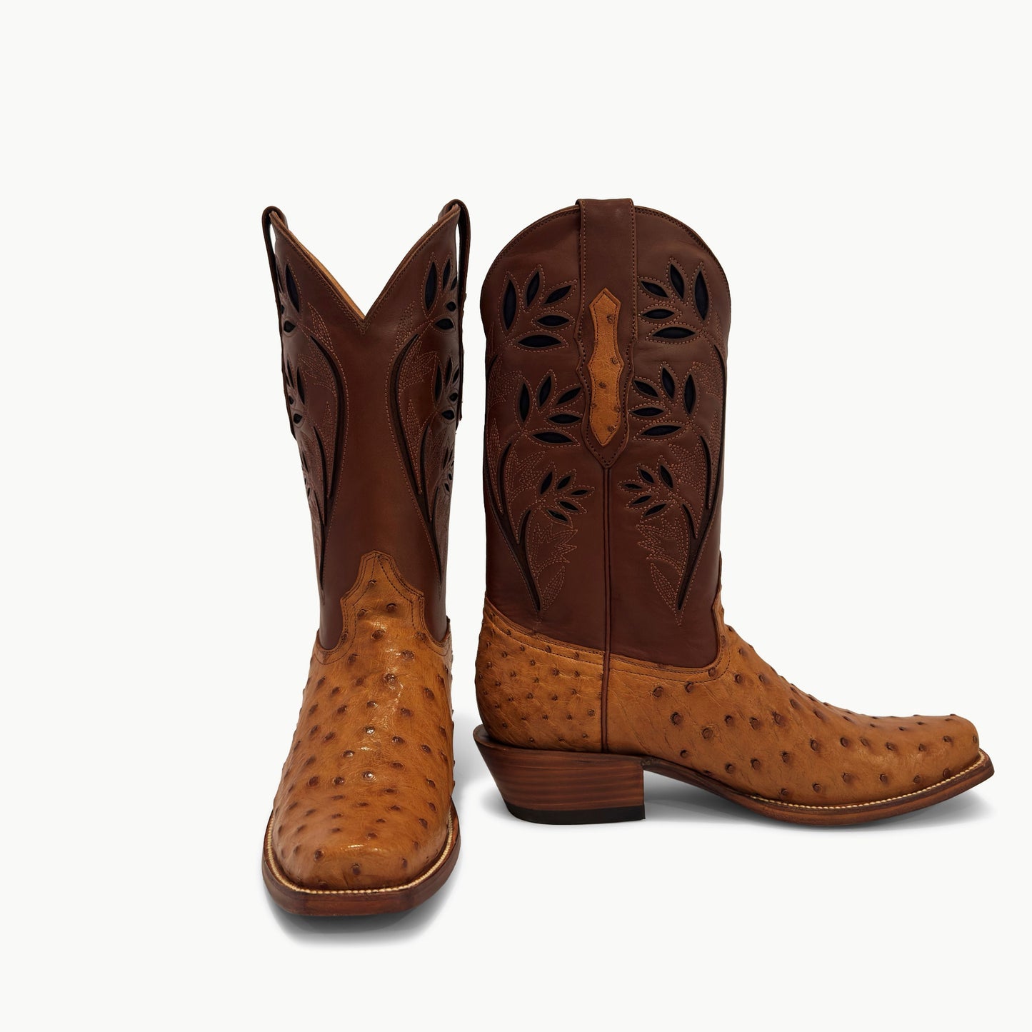J Charles cognac full quill ostrich cutter toe cowboy boot — pair showing front and side view with hand-cut floral leaf perforation shaft detail
